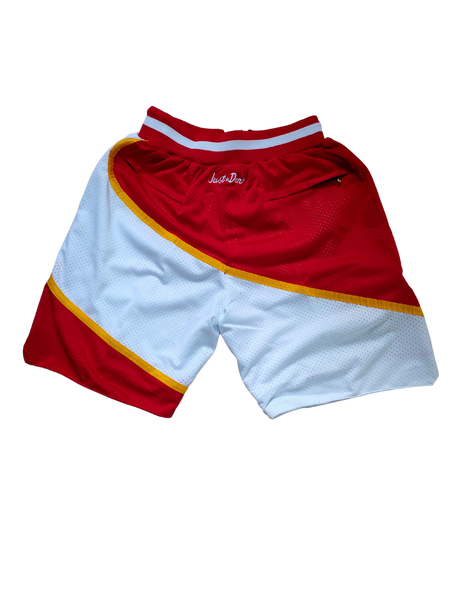Retro NBA basketball shorts with bold team logos and vintage design, featuring elastic waistbands and detailed stitching